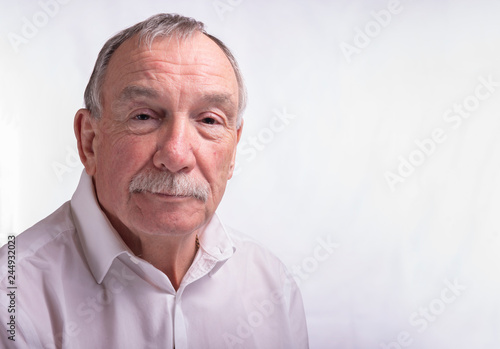 Portrait image of a senior man on white background with copy space 