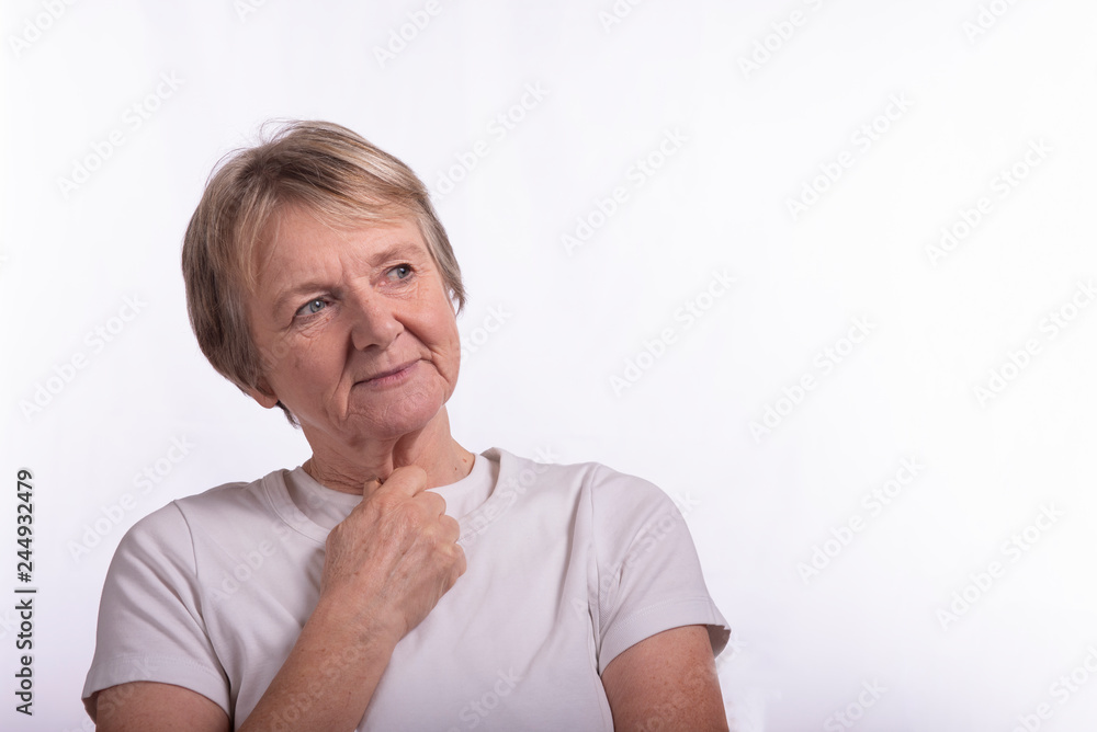 High key portrait of smiling mature woman, taken on a white background with copy space High key portrait of smiling mature woman, taken on a white background with copy space
