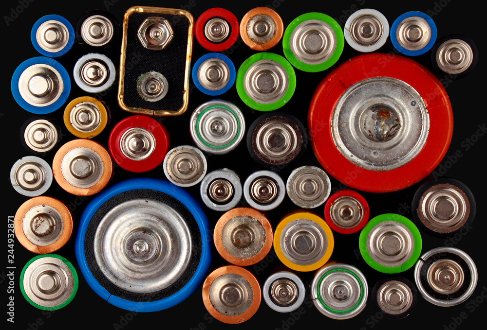 Old electric batteries on black background Old electric batteries on black background