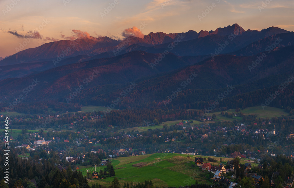 Tatra Mountains and resort Zakopane in the rays of the setting sun