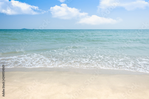 Beach sand with sea wave and sky background and summer day