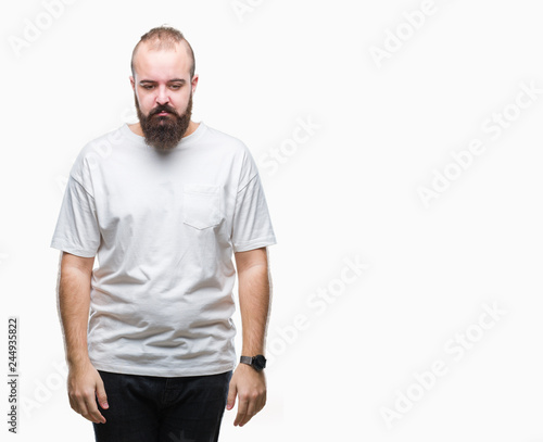 Young caucasian hipster man wearing casual t-shirt over isolated background depressed and worry for distress, crying angry and afraid. Sad expression.