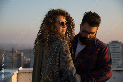 Hipster man and beautiful women with curly hair and sunglasses - Image