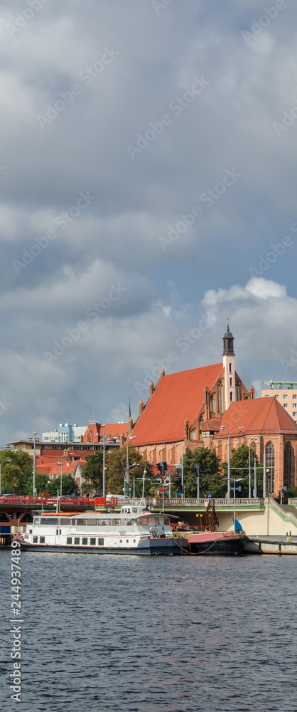 CITYSCAPE - A Bridge, a ship on the river, a church and a boulevard in Szczecin