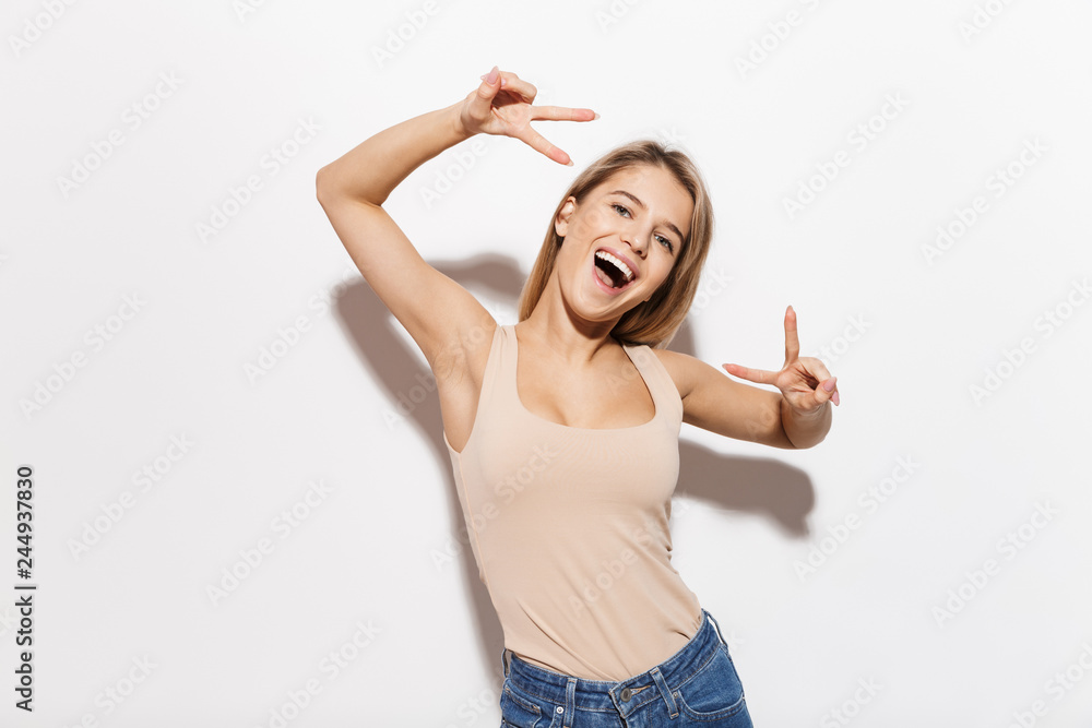 Beautiful young happy woman isolated over white wall background. Beautiful young happy woman isolated over white wall background.