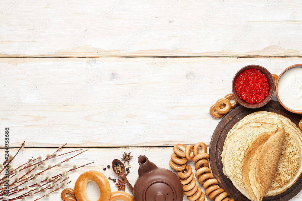 A Russian Tea Party including thin pancake blini, red caviar, sour cream and bagels