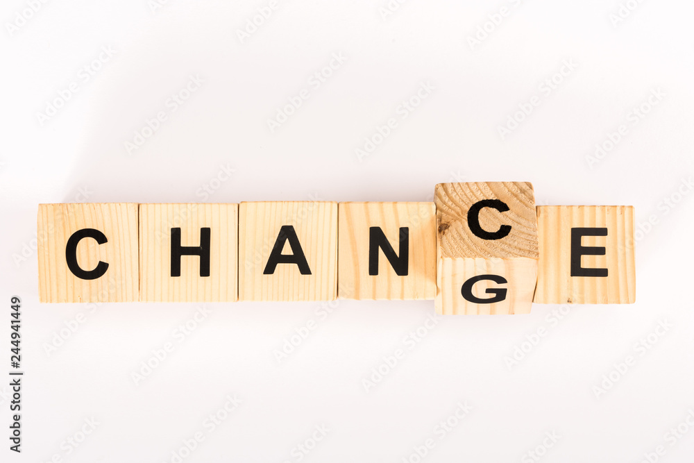 top view of change word made with wooden blocks isolated on white top view of change word made with wooden blocks isolated on white