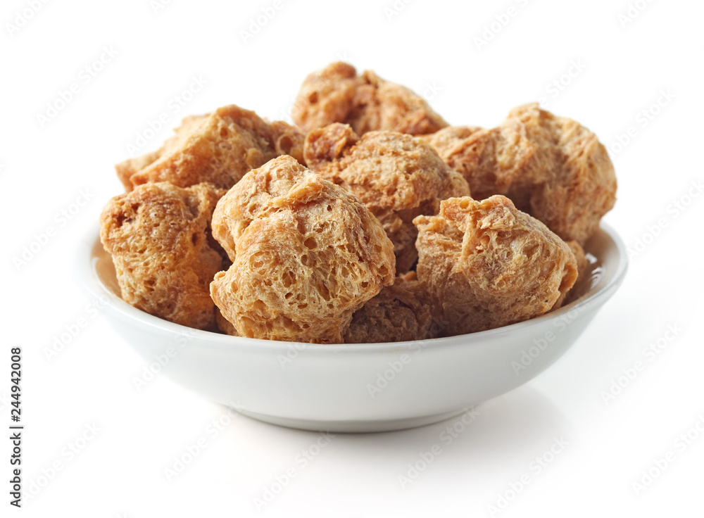 Bowl of soya chunks on white background Bowl of soya chunks on white background