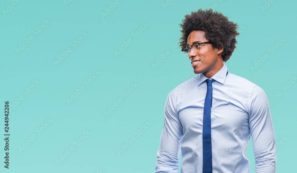 Afro american business man wearing glasses over isolated background looking away to side with smile on face, natural expression. Laughing confident. Afro american business man wearing glasses over isolated background looking away to side with smile on face, natural expression. Laughing confident.