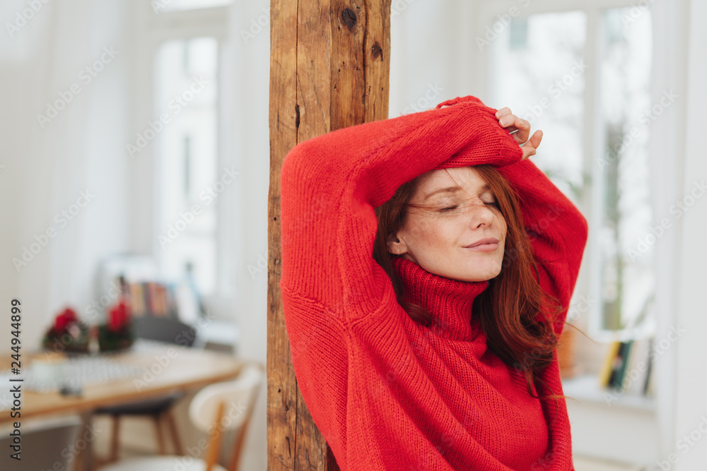 Dreamy young woman standing with her eyes closed Dreamy young woman standing with her eyes closed