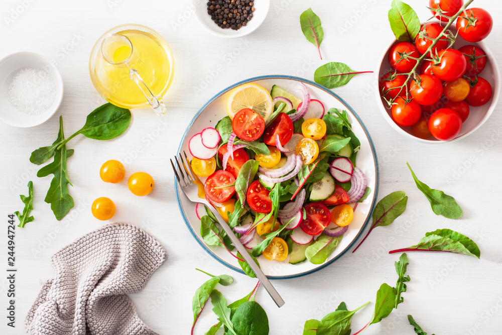 healthy colorful vegan tomato salad with cucumber, radish, onion - obrazy, fototapety, plakaty 