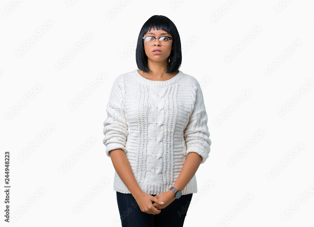 Beautiful young african american woman wearing glasses over isolated background Relaxed with serious expression on face. Simple and natural looking at the camera. Beautiful young african american woman wearing glasses over isolated background Relaxed with serious expression on face. Simple and natural looking at the camera.