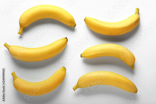 Tasty fresh bananas on white background