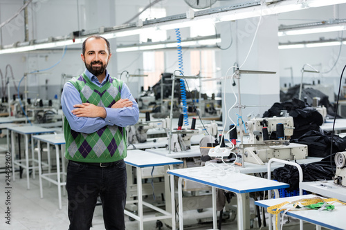 Adult male designer in factory.