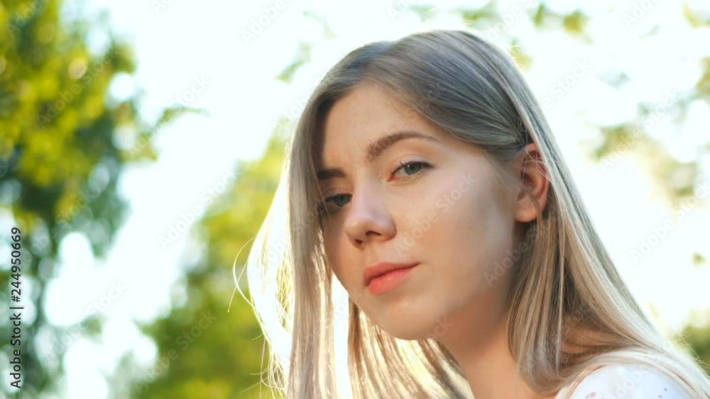 Closeup Beauty portrait of young woman. Teenager with lovely look and natural make up Closeup Beauty portrait of young woman. Teenager with lovely look and natural make up