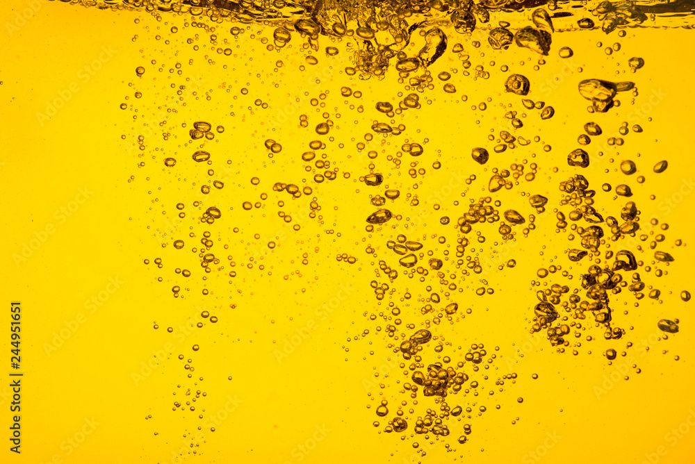 Bubble in liquid yellow color car oil or beer  juice syrup for background