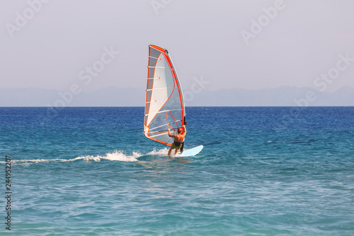 Windsurfing does extreme tricks