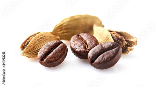 Coffee beans with cardamon isolated on white background