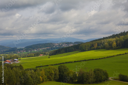 View over hills in the Bavarian forest with cloudy sky