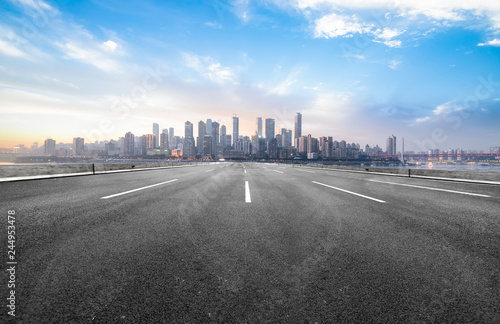 The expressway and the modern city skyline are in Chongqing  China.