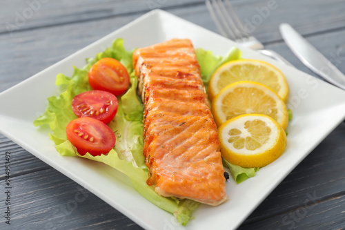 Piece of tasty grilled salmon on plate