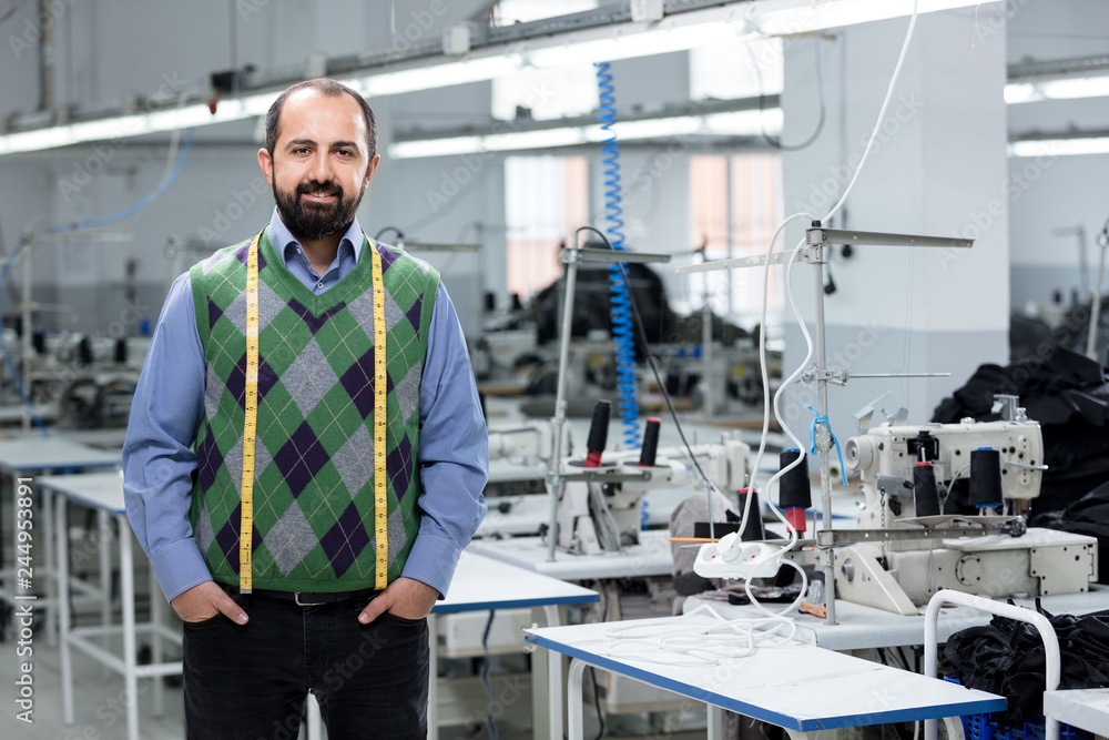 Adult male designer in factory. Adult male designer in factory.