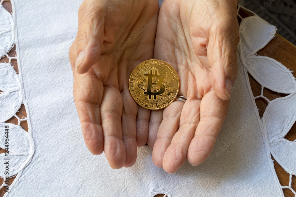 Fotografie Hands Holding Bitcoin ,Electronic - Digital Money