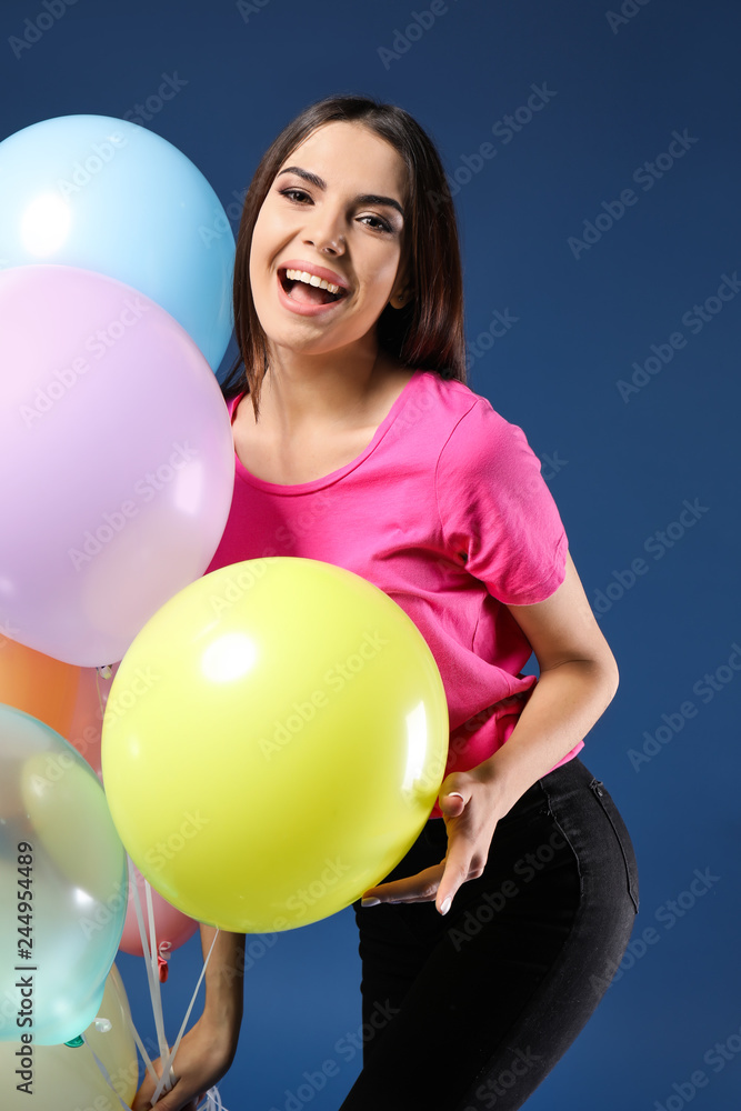 Beautiful young woman with balloons on color background Beautiful young woman with balloons on color background