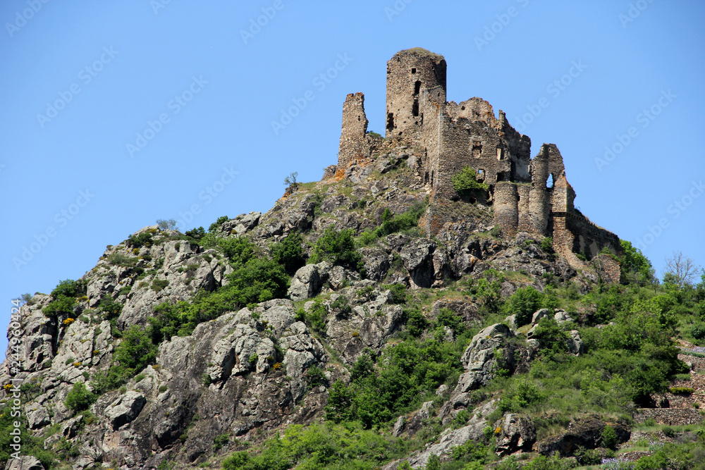 ruins of an old medieval fortress on the top of a mountain in France