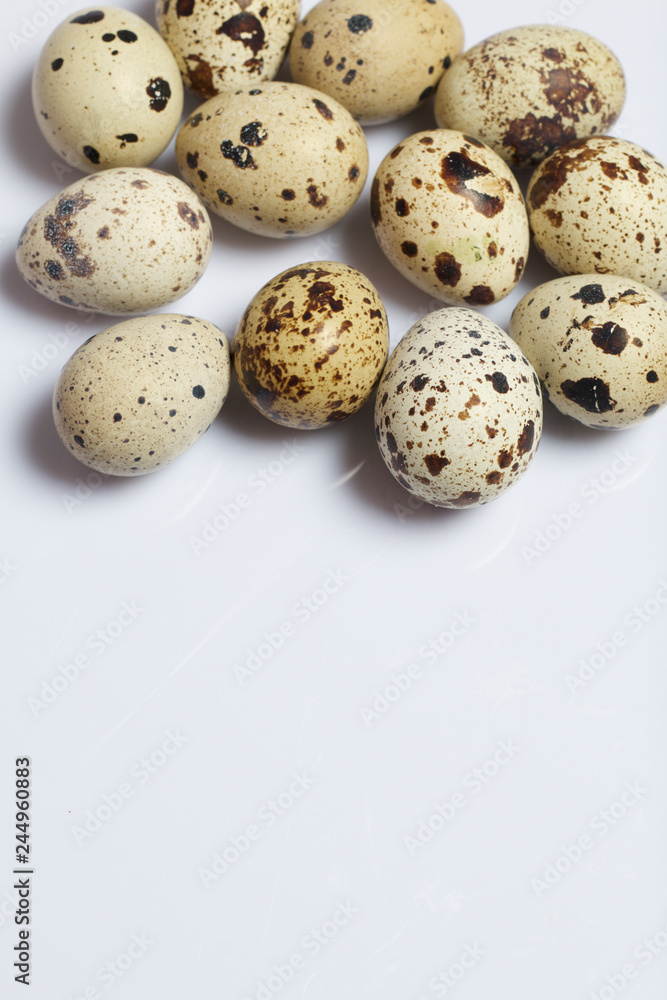 Quail eggs. Lie on a white background. Quail eggs. Lie on a white background.
