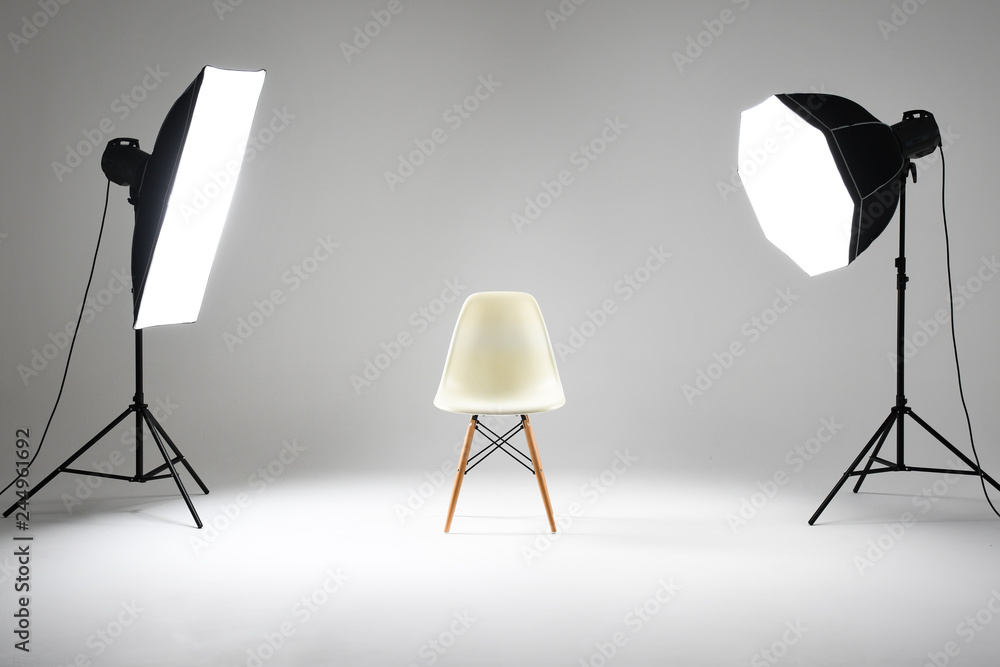 Photography Studio with Empty Chair and Flash Lights