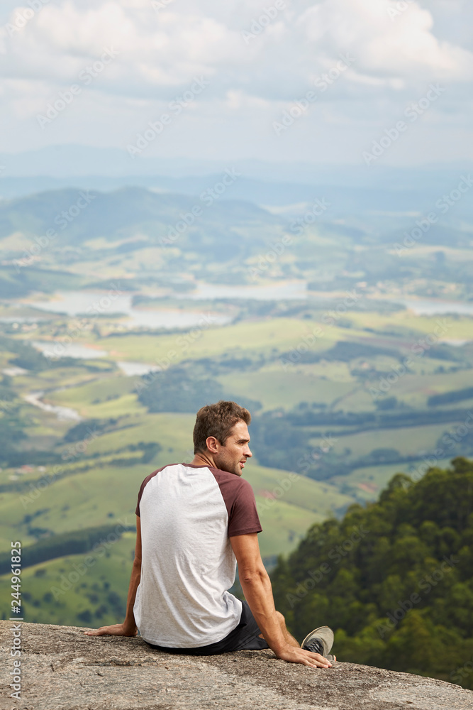 Handsome guy in t-shirt looking at view