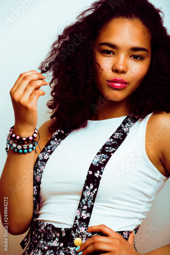 young pretty african american girl emotional posing on white background, lifestyle peopleconcept photo