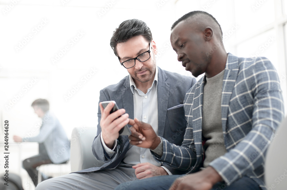 two business partners discuss work information. two business partners discuss work information.