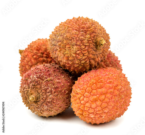  lychee fruit in shell on white background