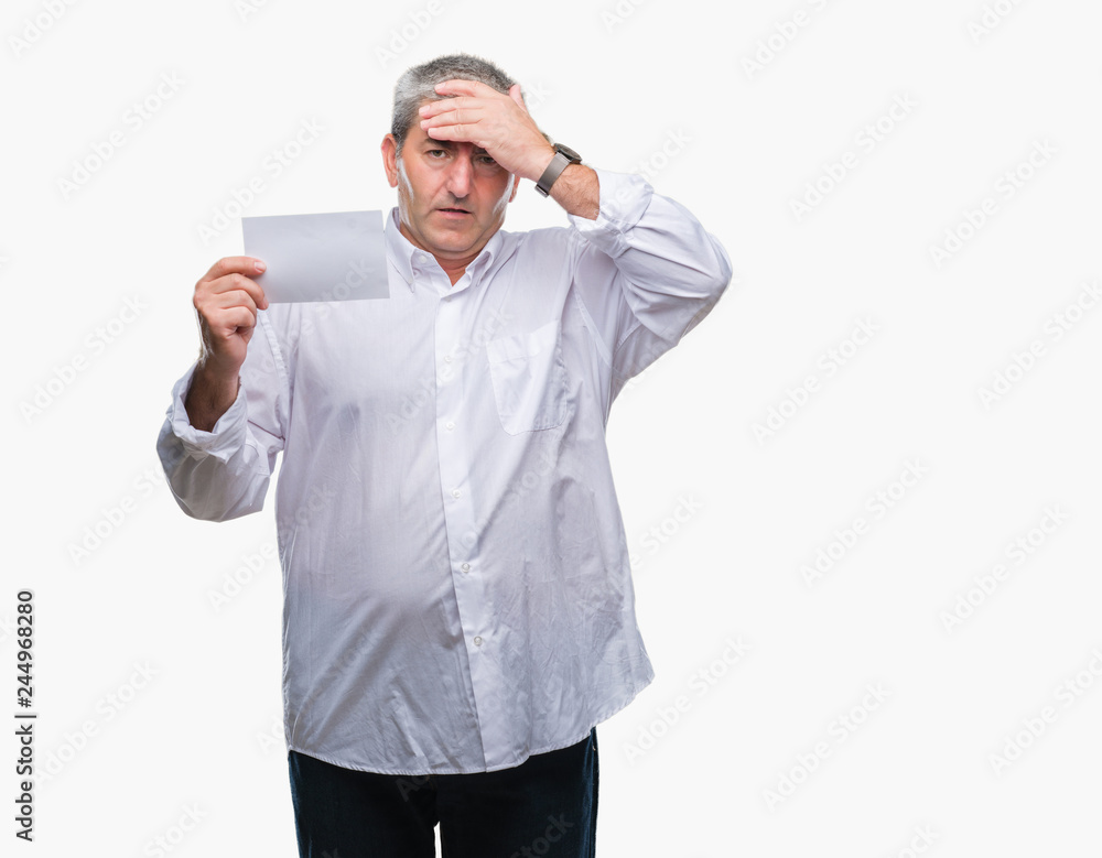 Handsome senior man holding blank card over isolated background stressed with hand on head, shocked with shame and surprise face, angry and frustrated. Fear and upset for mistake. Handsome senior man holding blank card over isolated background stressed with hand on head, shocked with shame and surprise face, angry and frustrated. Fear and upset for mistake.