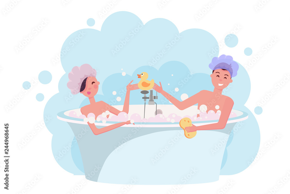 Young couple in shower caps taking a bath. Girl and guy are having fun