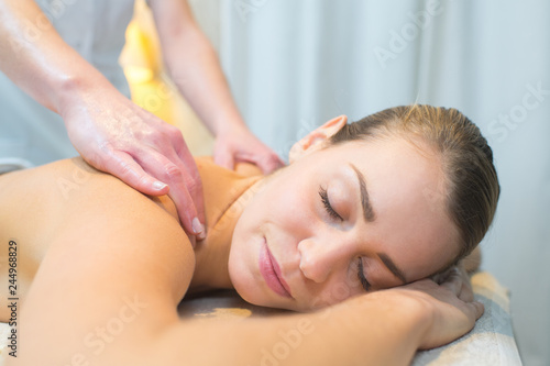 closeup of woman having back massage