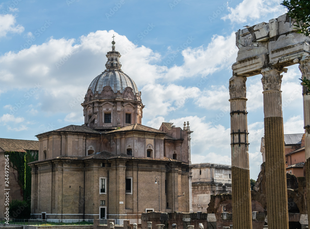 View on catholic church of Saint Luca e Martina (Chiesa dei Santi Luca e Martina) with remains of antique Roman forum in Rome, Italy