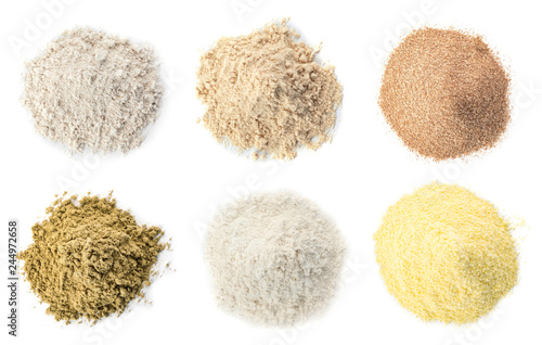 Set of different organic flour on white background, top view