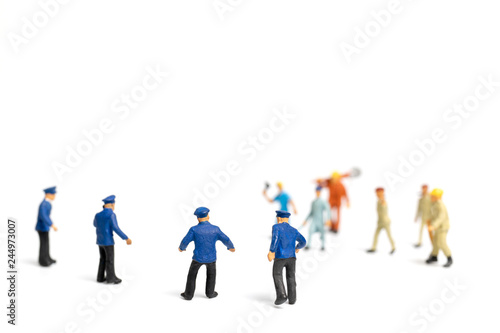 Miniature people   Police and an angry mob on white background
