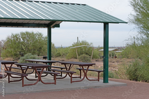 Gazebo with green metal roof and pick nick tables
