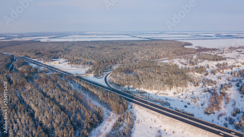 Winter aerial shot of transport junction, federal highway in Russia