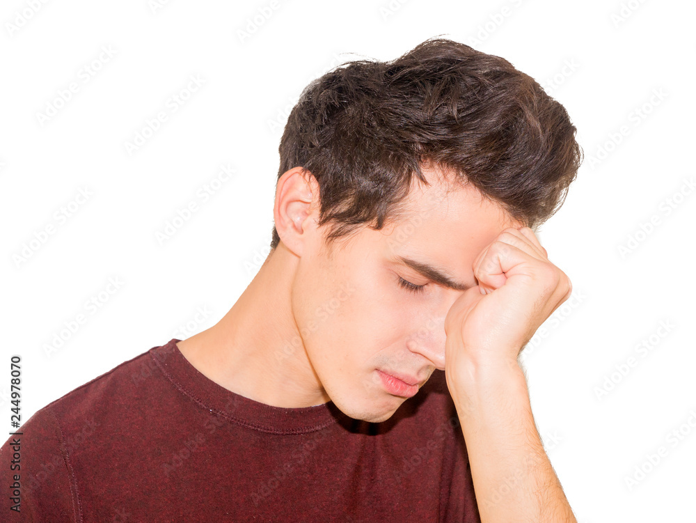 Portrait of sad depressed handsome young man, hand on face, isolated on grey background. Portrait of sad depressed handsome young man, hand on face, isolated on grey background.