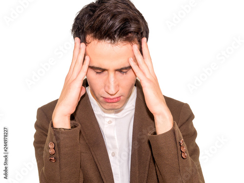 Upset unhappy man squeezing head with hands. People, stress, tension and migraine concept.