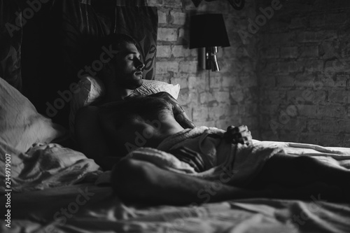 a man in bed wakes up