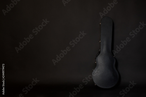 guitar case on dark background