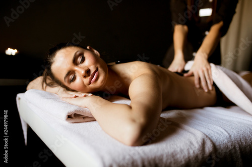 Young woman having a hot stone massage