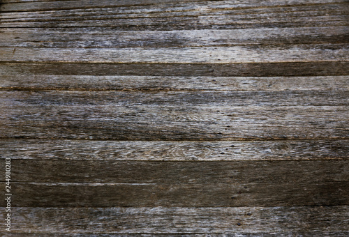 Wood planks texture dark background or wallpaper. overlap wooden wall horizontally have damage of old. Dark brown rustic aged barn wood planks background. Space for text, copy, lettering