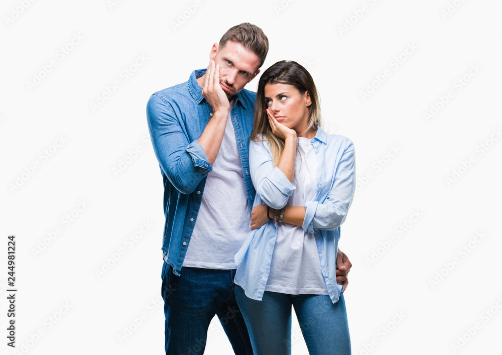 Young couple in love over isolated background thinking looking tired and bored with depression problems with crossed arms. Young couple in love over isolated background thinking looking tired and bored with depression problems with crossed arms.
